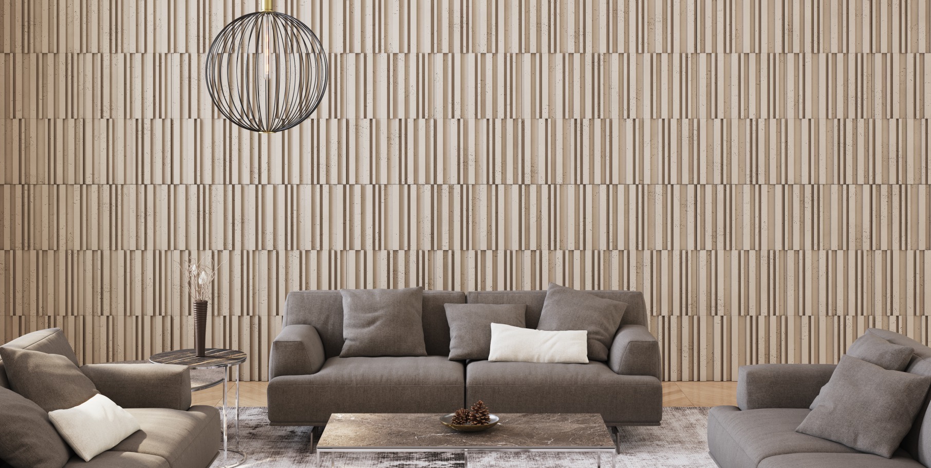 Wohnraum mit heller strukturierter Betonwand und grauem Sofa